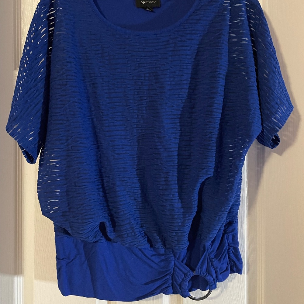 Bright blue blouse, very comfortable and flattering with buckle on the front